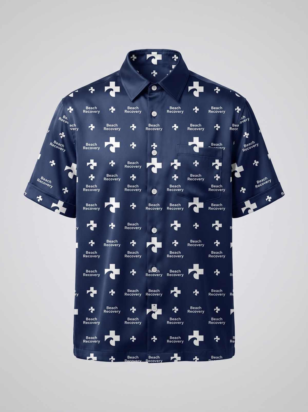 Silk Beach Shirt, Navy colourway — design concept rendering for the Navy kit. Deep navy silk with the Beach Recovery mark repeat reversed to white.